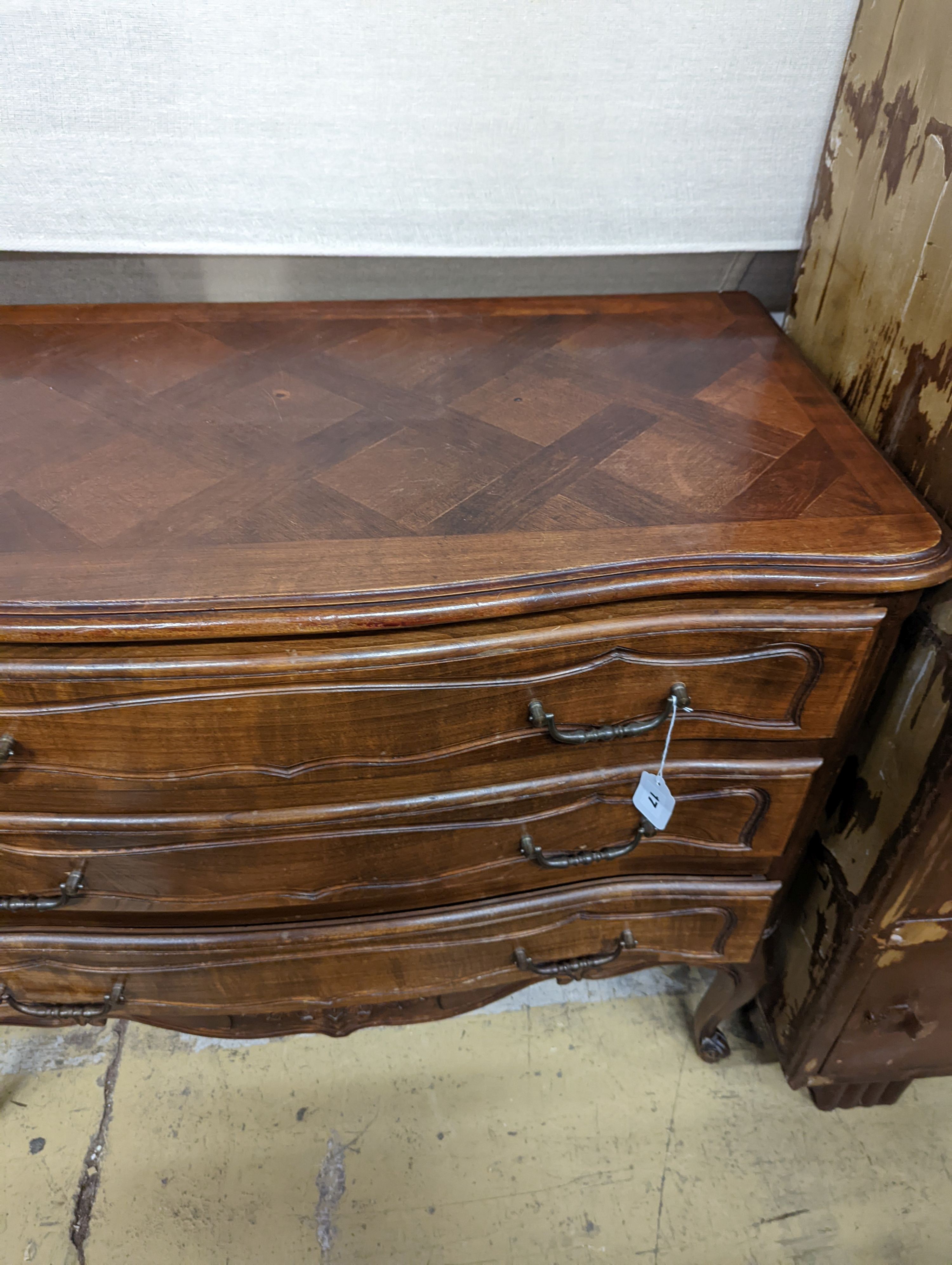 A Louis XV style walnut commode, fitted three long drawers. W-100cm, D-51cm, H-84cm.